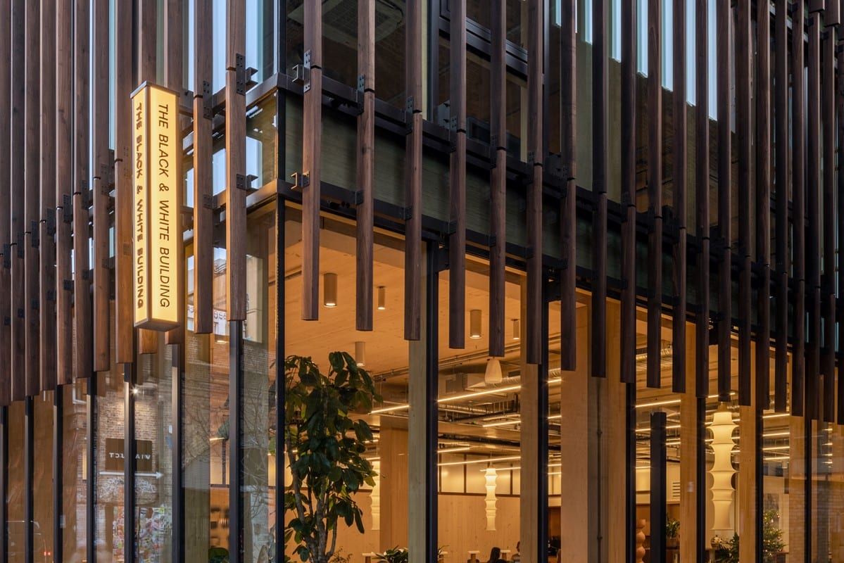 Warm timber reception and collaborative client meeting lounge at Highwoods Group Shoreditch